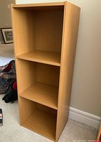 Front view of the three cubby shelf unit showing all compartments clearly.