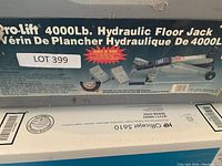 Box with Pro-Lift 4000Lb Hydraulic Floor Jack branding and product information, showing bilingual English/French text and product images.