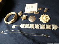 Overview of all items laid out on dark fabric