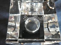 Close-up of the Rosenthal engraved signature on the bottom of one crystal candle holder.