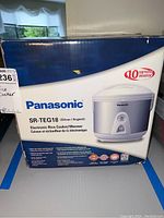 Front of the Panasonic SR-TEG18 rice cooker box showing brand, model, and product image