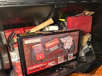 Boxed Craftsman laser level combo kit in black plastic trunk with other tools