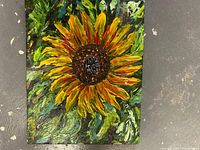 Full view of an 8x10 inch sunflower oil painting with thick textured paint and vibrant colors.