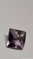 Close-up front view of the 4.61ct purple pink amethyst gemstone showing square shape and checkerboard cut facets.