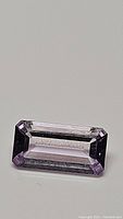 Close-up image of the 2.19ct natural pink amethyst emerald cut gemstone showing color and clarity.