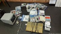 Full view of Atari ST system components: computer, monitor, mouse, joysticks, software disks, and hard drive