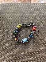 Top view of sterling silver and Murano glass bracelet showing colorful beads and clasp