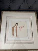 Framed Serigraph of female wearing tassel hat on tufted background