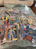 Photo showing multiple comic books in a bundle including Infinity Crusade, Silver Surfer, and The Dark Knight titles