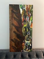 Canvas art showing glass bottles with prominent shadows on a wooden surface.