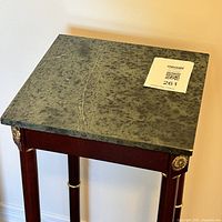 Top view of the green marble tabletop showing texture and detailing.