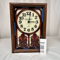 Full view of Phinney Walker stained glass clock in wood frame showing front and face, indicating good working condition.