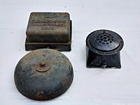 Top view of two-piece lot with fire alarm bell, transformer gong, and small alarm horn showing condition and details