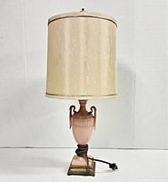Full view of vintage Beckwith China pink ceramic table lamp with attached fabric shade, showing overall lamp including metal base and power cord.