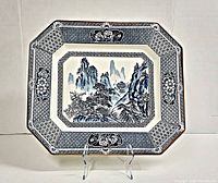 Front view of the large rectangular platter showing the oriental landscape scene and decorative border with gold edge trim.