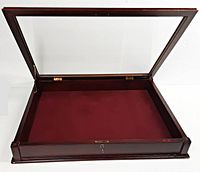 Open display case showing hinged glass top lid and burgundy cloth lining inside.