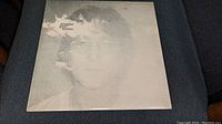 Front cover of John Lennon Imagine vinyl LP album with grayscale portrait of John Lennon.