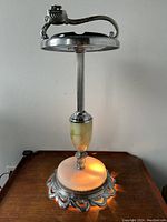 Front view of entire floor ashtray with lighter and illuminated base