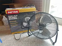 Side view of Patton fan with original box showing 18 inch size and metal construction