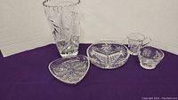 Full set of pinwheel crystal glassware items including vase, creamer, sugar bowl, and two appetizer plates.