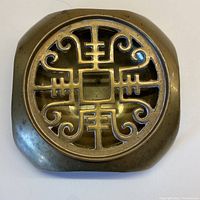 Top view of the solid brass incense vessel showing square shape and ornate cut-out lid.