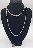 Front view of the silver chain necklace displayed on a black neck bust, showing full length with clasp visible at top.