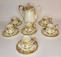 Full set: coffee pot, six cups on saucers