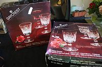 Two unopened and worn Baycrest boxes of crystal glasses showing front packaging and brand name