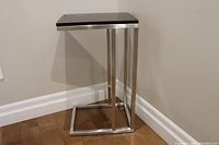 Side view of metal frame with wood top showing the overall design and condition