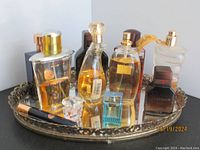 Full view of all bottles arranged on the ornate mirror tray.