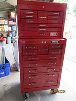 Front view of combined Proto top and bottom red tool cabinet on caster wheels, showing drawer layouts and brand logos
