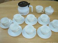 Complete tea and coffee set including 8 cups with saucers, creamer, covered sugar, and server pot in Victoria pattern