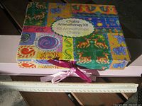 Colorful box of the Chakra Aromatherapy Kit showing dimensions and packaging.