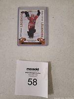 Front of Manon Rheaume hockey card showing female goaltender in red uniform and gear with 'UD Career Legends' and 'Tim Hortons' labels.