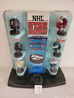 Full view of McDonald's NHL Star Helmets display stand with all figures inside clear domes and the central promotional information.
