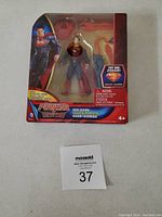 Superman Powers Metropolis Heat Vision action figure in original sealed packaging against a plain background with lot tag number 37
