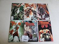 Photo showing six Thor comic books arranged in two rows of three, various cover art featuring Thor character.