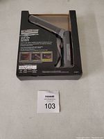 Photo showing the Eliminator 3W COB LED work light in its packaging box, front side with product name and details.