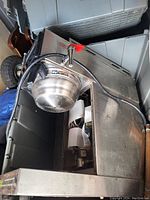 Commercial drink machine showing stainless steel bowl, spout, and stainless steel housing.