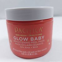 Image of Pacifica Glow Baby Brightening Peel Pads showing the container front label with product details.