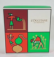Colorful gift box with artistic design and L'Occitane en Provence branding front view.