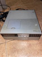 Silver vintage JVC HR-2650U video cassette recorder showing top and front panel with cassette door and control buttons.