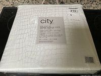 King size duvet cover set in original packaging with visible City branding and alligator pattern.