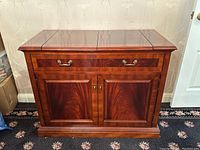 Front view of closed server showing drawer and cabinet doors