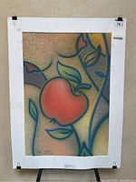 Full view of framed pastel artwork Woman - Apple Tree showing abstract shapes, a red apple, leaves, and stylized forms.