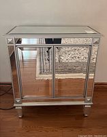 Front-facing view showing two mirrored doors and overall frame