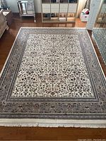 Full view of the carpet laid flat on hardwood floor