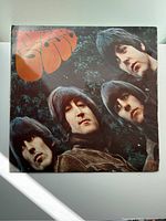 Front cover of the Rubber Soul LP showing all four Beatles band members and the album title in orange.