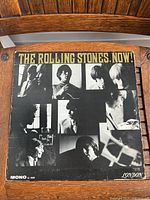Front cover of The Rolling Stones, Now! 1964 Mono LP showing black and white photos of the band members and title in yellow.