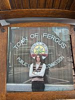 Front cover of Town of Fergus LP showing artist standing in front of a window with text 'Town of Fergus Public Utilities Commission'
